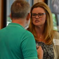 Two alumni enjoying conversation